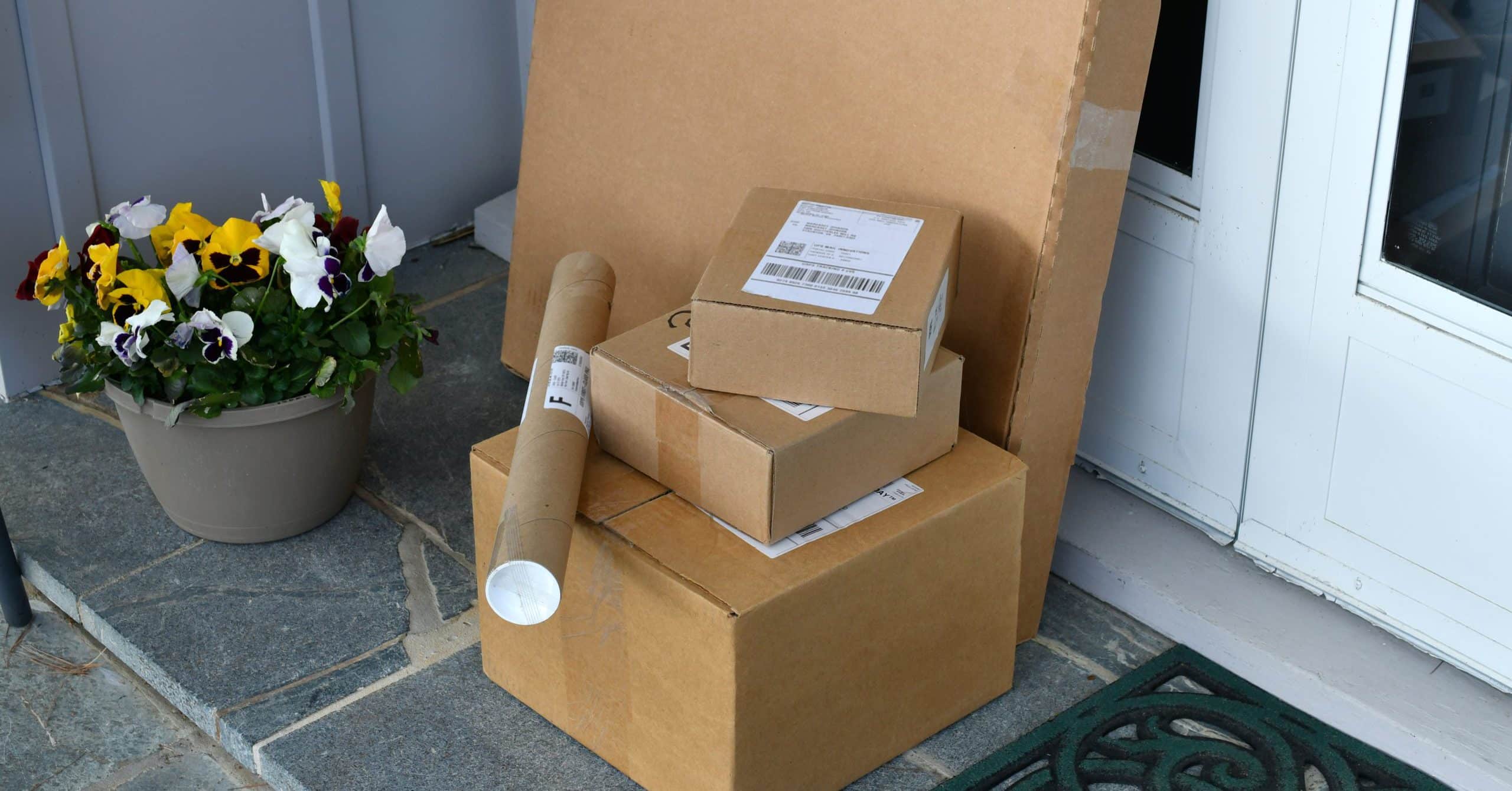 A stack of parcels left outside a front door