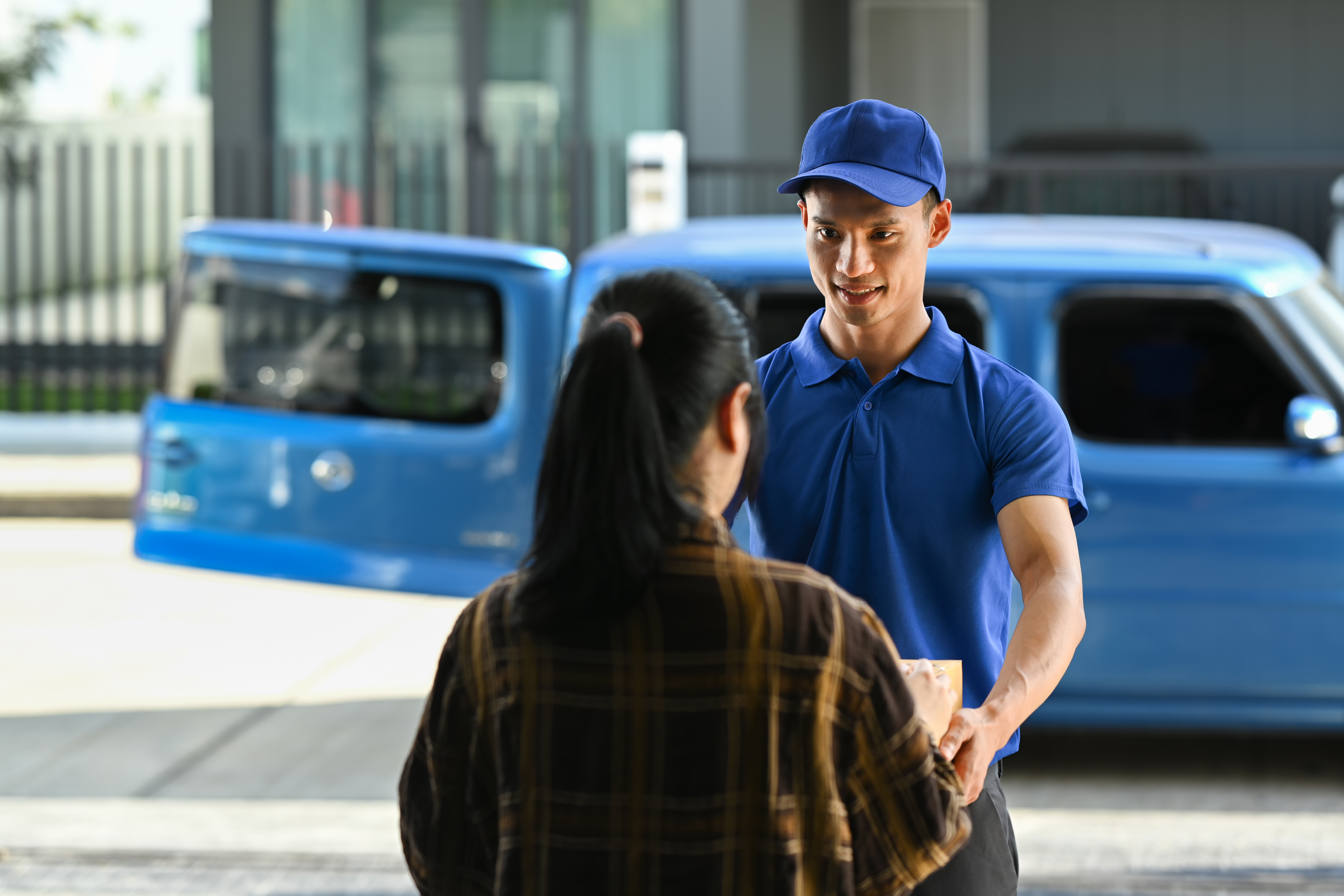 Delivery driver delivering a package to a customer