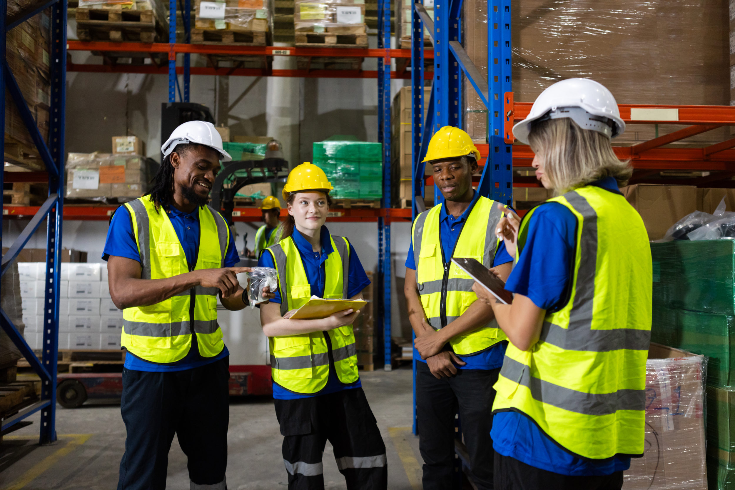 Warehouse workers having a meeting