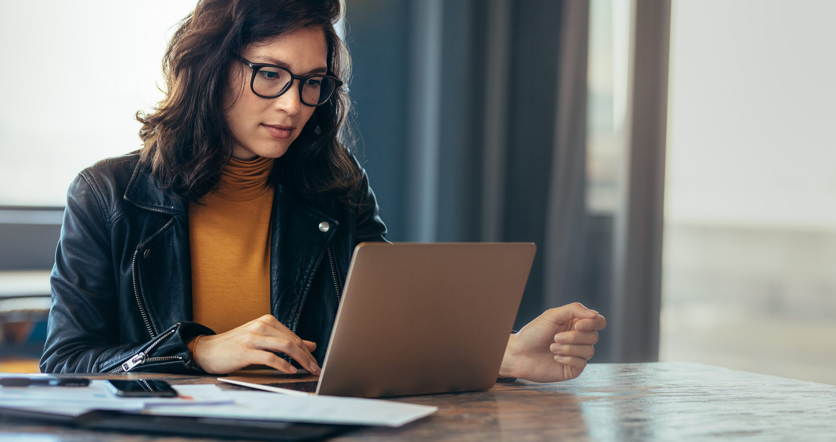 Person focusing on work on a laptop