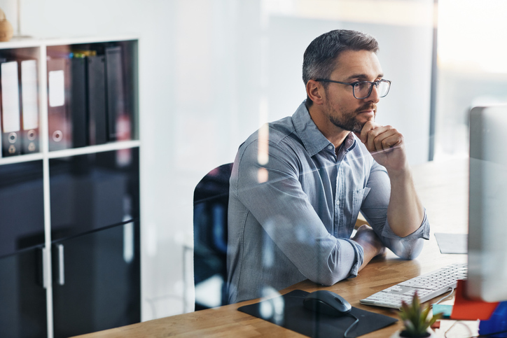 man sat at desk