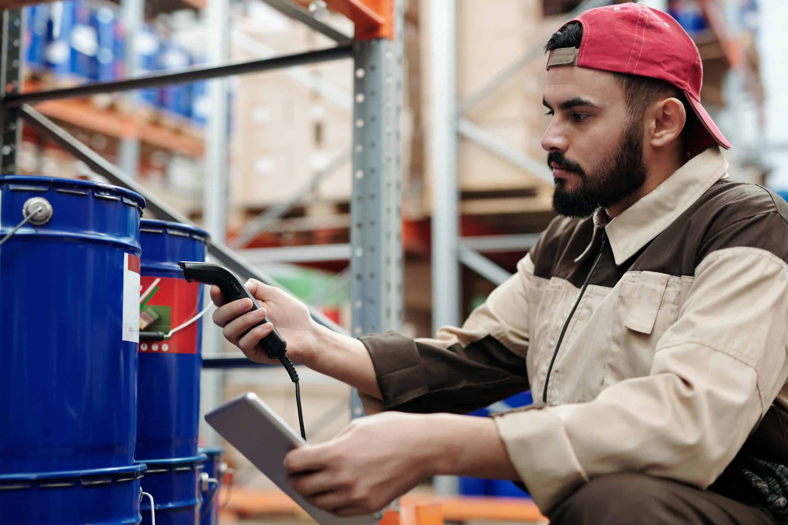 Man scanning goods in warehouse