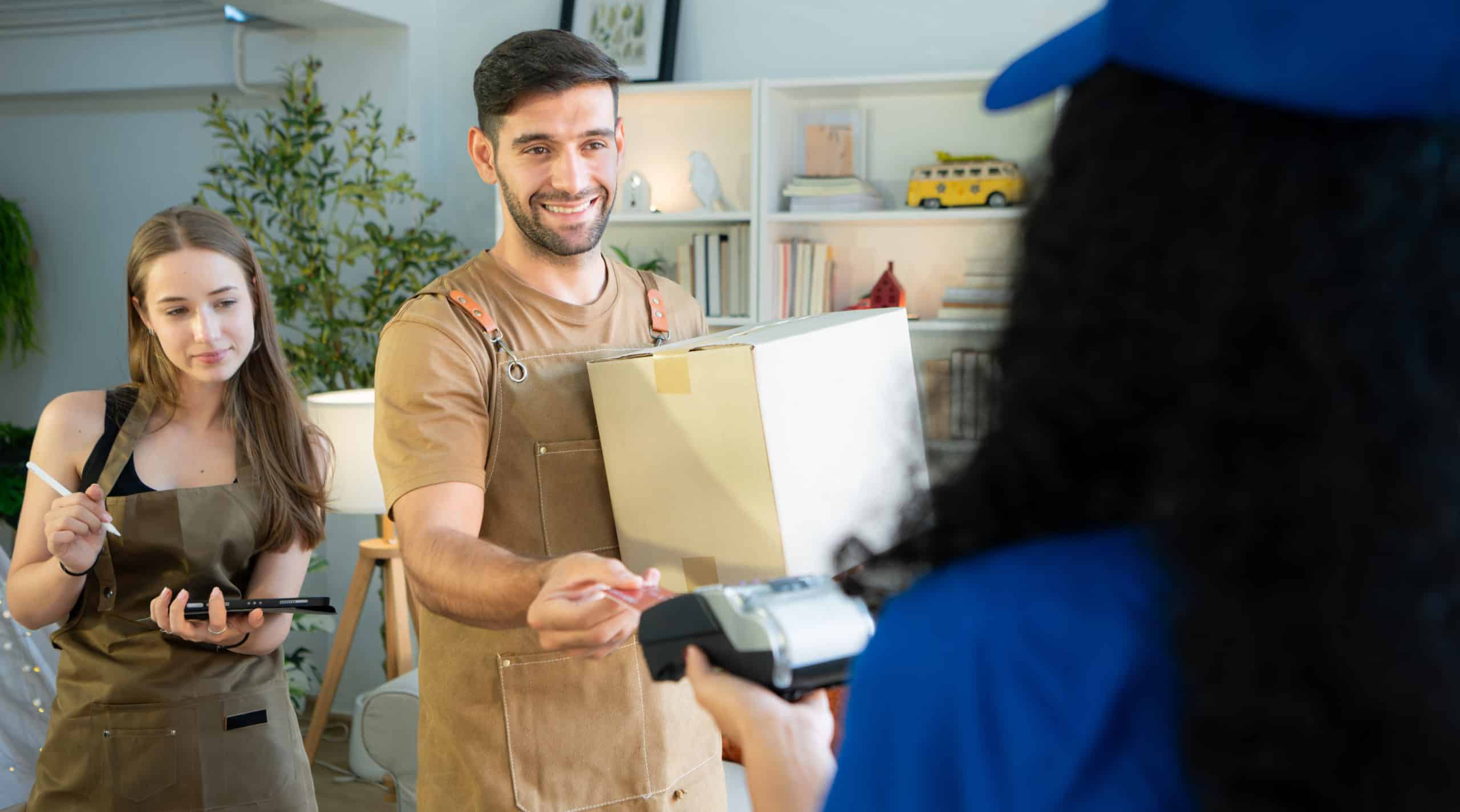 Small business owner sign to receive the product on board from the delivery person